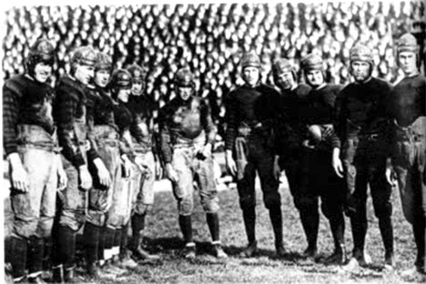 Historic black and white photo of football players.