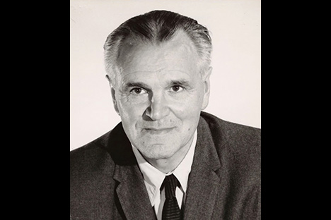 Black and white portrait of man with graying hair looking past viewer