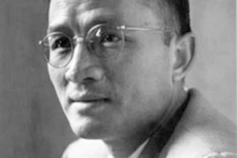 Asian male wearing wire-rimmed glasses