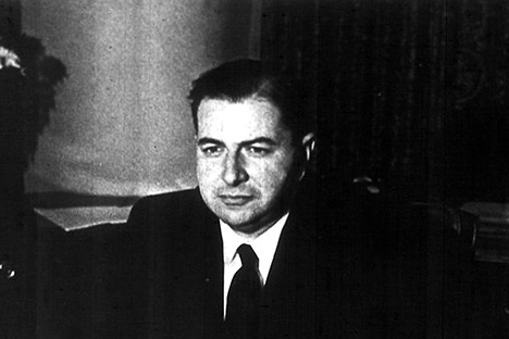 Black and white photo of man wearing suit and tie