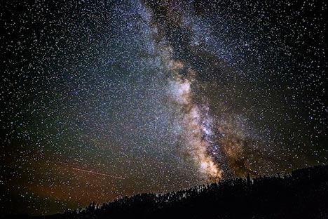 Night sky with a density of stars and the Milky Way galaxy