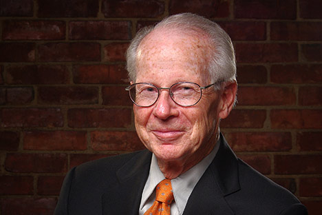 Smiling man wearing glasses looking at viewer